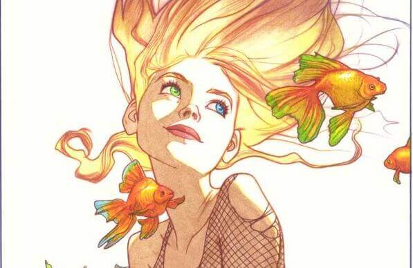 Kvinna med guldfiskar