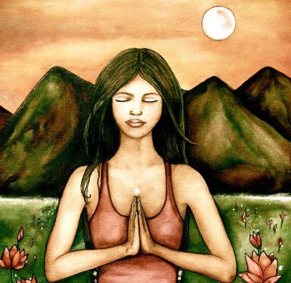 Kvinna som mediterar