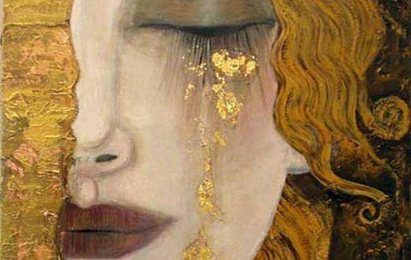 Kvinna gråter guld