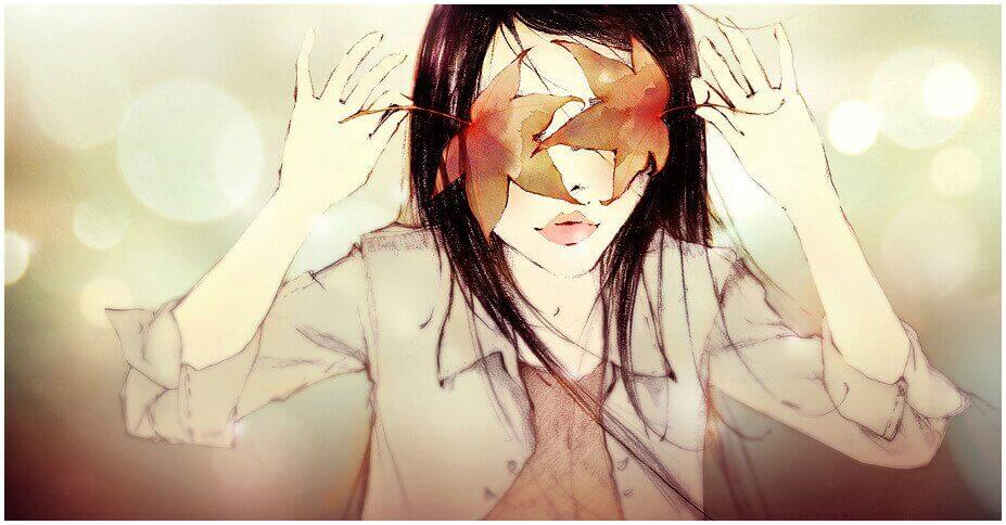 Kvinna med löv för ögonen