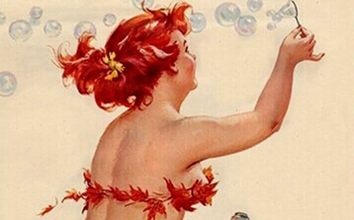 Kvinna som blåser såpbubblor