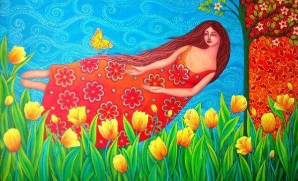 Kvinna på fält som har få saker