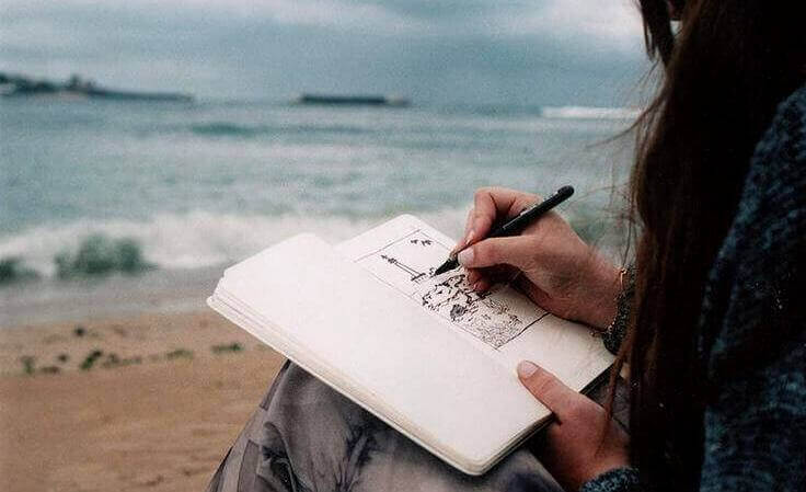 Skriver på stranden
