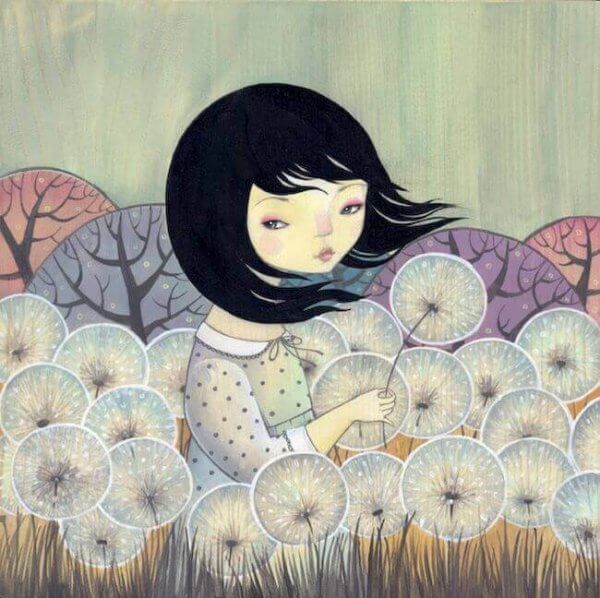 Flicka bland maskrosor