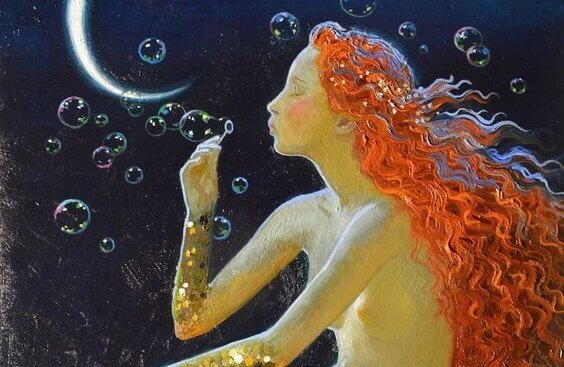 Kvinna som blåser bubblor