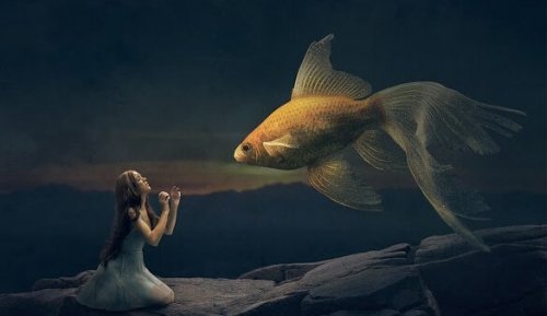 Flicka och guldfisk