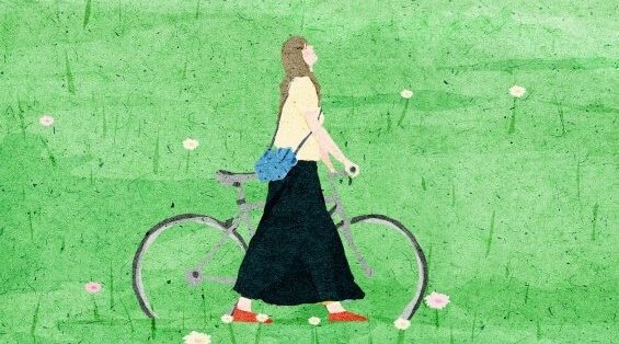 Kvinna med cykel