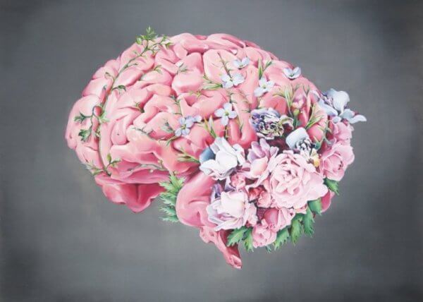 Blommor på hjärna som symboliserar citat från António Damásio