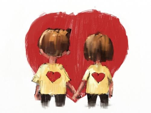 Par som håller hand framför hjärta.