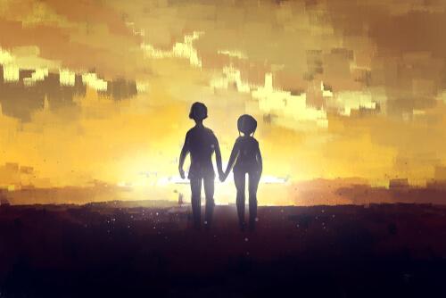 Par som håller hand i skymningen.