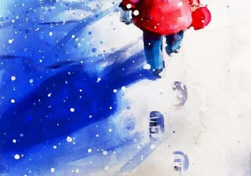 Pojke som går i snö