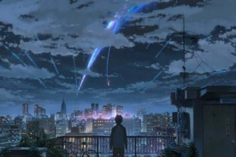 En ung person som tittar ut över en stad där meteorer faller från himlen